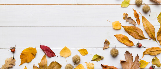 Autumn composition. Pattern made of dried leaves and other design accessories on table. Flat lay,...