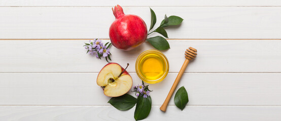 Flat lay composition with symbols jewish Rosh Hashanah holiday attributes on colored background, Rosh hashanah concept. New Year holiday Traditional. Top view with copy space