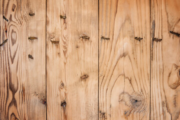 Brown distressed rustic wood grain with twig imperfections and scratches. Overhead view of old dark brown wooden table. Texture or abstract background. Place for text.