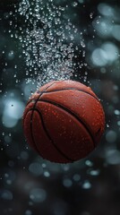 A basketball submerged in water with bubbles. Concept of sports and water.