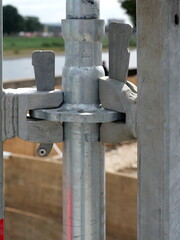 Metal construction scaffolding with sturdy connectors outdoors. Close-up. Copyspace.