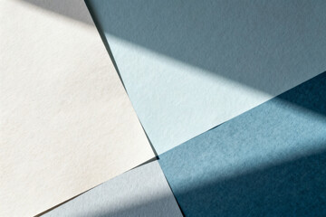 Abstract composition of overlapping colored paper sheets with geometric shadows and soft lighting