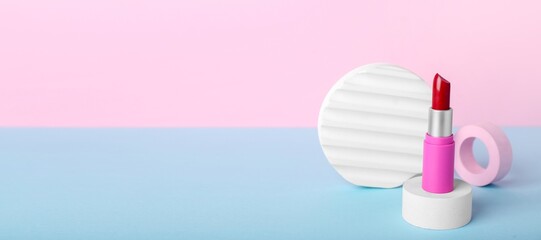 Decorative podiums with lipstick on color background with space for text