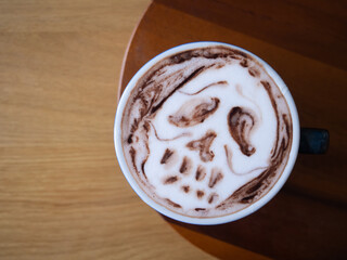 coffee latte art brown white cappuccino drink cup hot beverage espresso milk foam cafe breakfast caffeine barista design halloween sugar skull dead horror death wooden table background selected focus