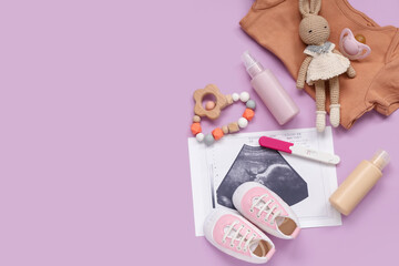 Composition with baby clothes, sonogram image, pregnancy test and bottles of cosmetic products on purple background
