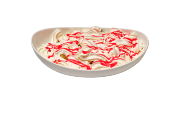 Dessert topped with airy whipped cream and strawberry syrup in a white oval bowl — a vibrant and appetizing sweet treat.