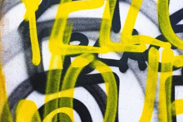 Abstract graffiti pattern in bold yellow, black on white background. Urban, vibrant, with street, edgy appeal. Creative poster, flyer, digital art, modern urban art display.
