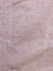 Close up of beige textured cotton towel fabric pattern background