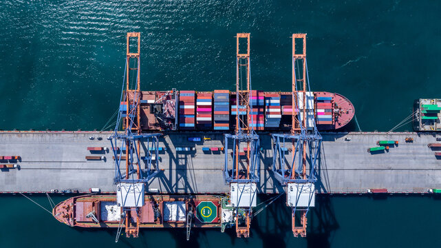 Aerial view container cargo ship international port terminal with gantry crane, Global business import export logistic maritime transport by container cargo ship vessel, Container ship cargo freight. - Powered by Adobe