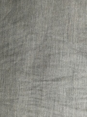 Close up of gray denim fabric texture background