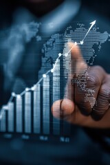 Closeup of a person analyzing upward financial graph with global connections