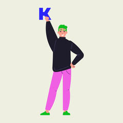 Expressive young person with vibrant green hair holding the letter K