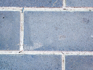 Fototapeta premium Close up of blue brick wall with mortar lines