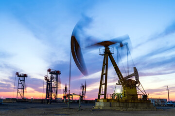 In the evening of oilfield derrick