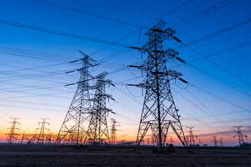 The pylons are in the evening, Substation in the evening, High voltage substation and beautiful sunset glow