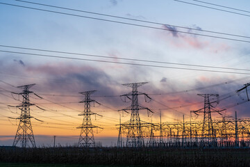 The pylons are in the evening, Substation in the evening, High voltage substation and beautiful sunset glow