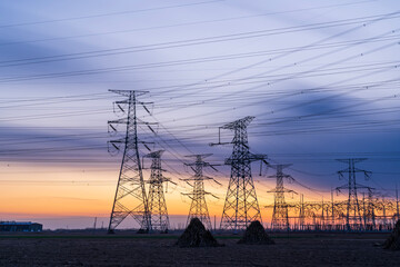 The pylons are in the evening, Substation in the evening, High voltage substation and beautiful sunset glow