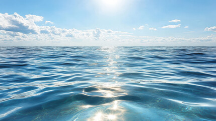 Fototapeta premium Calm ocean surface reflecting sunlight under clear blue sky creates serene atmosphere