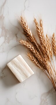 Natural soap and wheat sprigs on marble