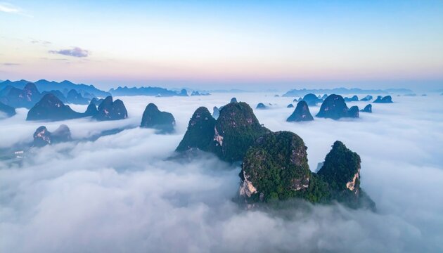 Karst pinnacles in morning haze with layered silhouettes representing limestone tower landscape and ethereal aerial depth suitable for travel covers education visuals and tranquil design