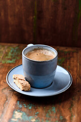 Cup of coffee on rustic wooden background. Soft focus. Copy space	