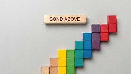 Fototapeta premium Colorful Wooden Blocks Forming a Staircase with Bond Above Message