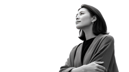 **Aspiring Glance: A young professional woman gazes upwards, a symbol of ambition and hope, her gaze a clear window into her dreams, captured in elegant monochrome.**