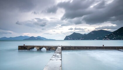Serene Lake Pier Landscape with Mountains.