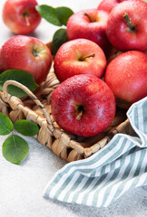 Fresh red apples resting in a basket, a symbol of healthy eating