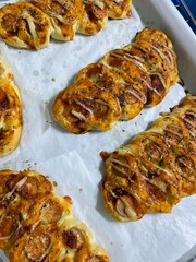 Korean baked sausage bread. Hot dogs encased in dough, and slit into a leaf pattern.