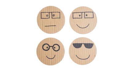 Set collection or collage of hand drawn face emoji with glasses on corrugated cardboard paper isolated on transparent background