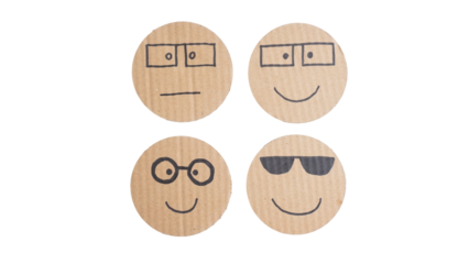 Set collection or collage of hand drawn face emoji with glasses on corrugated cardboard paper isolated on transparent background