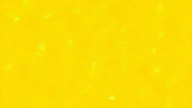 Looping animation of a group of yellow plastic triangular geometric shapes.