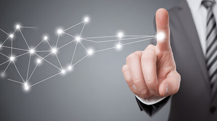 Businessman pointing at a digital network of connected nodes, symbolizing technology and connectivity
