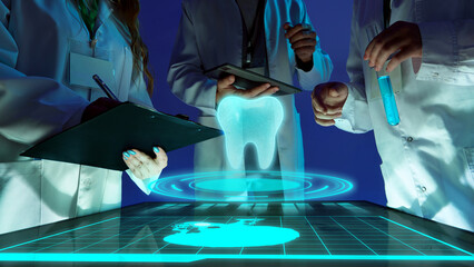 Creative digital artwork. Group of scientists analyzing holographic tooth projection. Concept of...