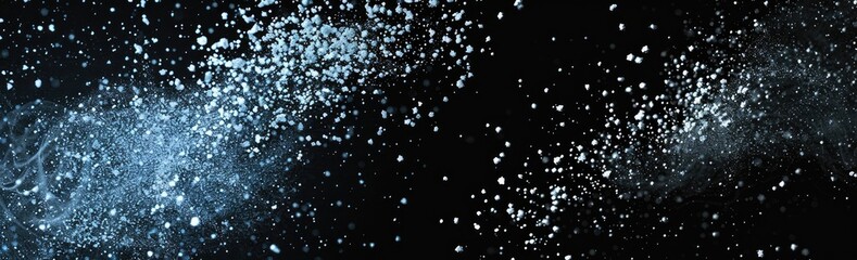 Obraz premium Abstract image of light blue particles scattered on a black background, creating a sense of movement and energy