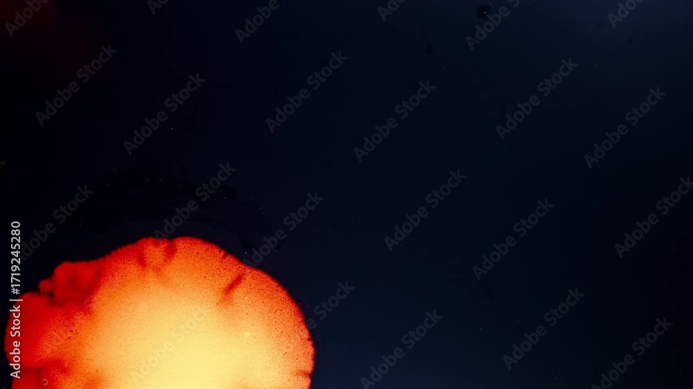 Poster colorful ink dissolves in liquid, creating a vibrant abstract effect