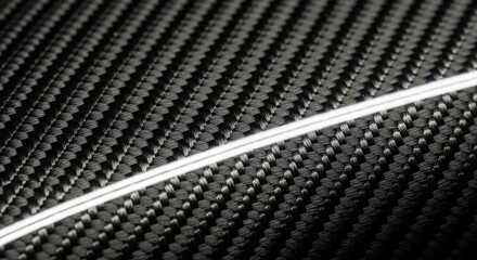 Close-up of Carbon Fiber Texture with White Line.