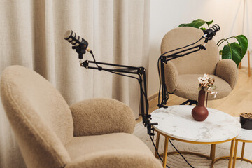 Creative podcast studio setup with professional microphones and comfortable chairs for recording sessions
