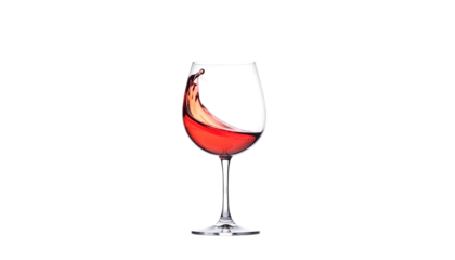 Swirling ros? wine in a clear stemmed glass against a black background