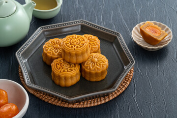 Cantonese moon cake for Mid-Autumn Festival food mooncake on blue table background.