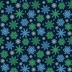 Seamless Snowflake Pattern Repeats on Dark Blue Background with Blue and Green Flakes