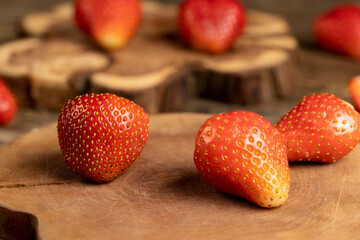 ripe red strawberries, ripe sweet and juicy strawberries on a wooden table