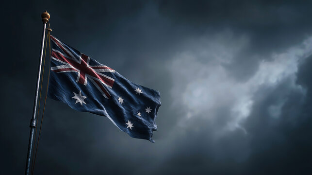 Australian flag waving proudly against a dramatic stormy sky background image