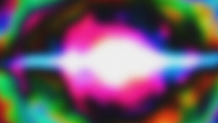 Abstract vibrant colors blur with a central bright spot.