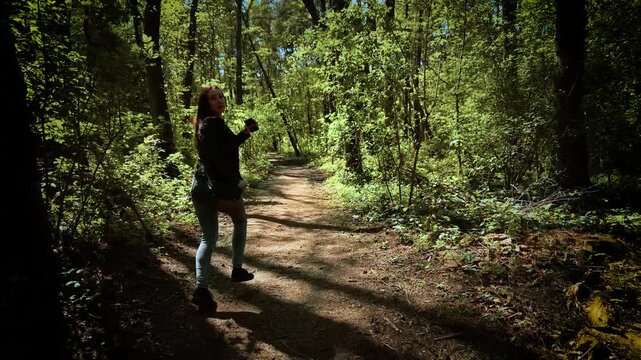 Horrified woman running and looking back in terror from serial killer. Scared female fleeing and glancing behind in panic from maniac. Frightened lady escaping and turning around in fear from murderer