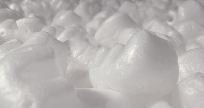 Foam plastic white packaging filler in the form of numbers, environmental pollution, waste problems