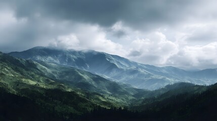 Majestic green mountains stretching across the horizon under a dramatic cloudy sky bathed in soft natural light