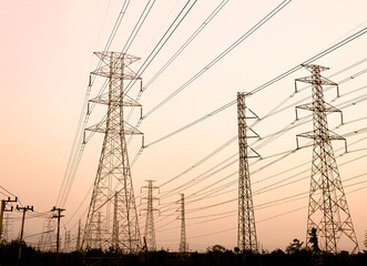 silhouette high voltage pole on sky sunset background.	