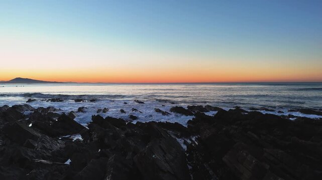 Rocky Uhabia beach of Bidarte hit by the sunset at the Basque Country.